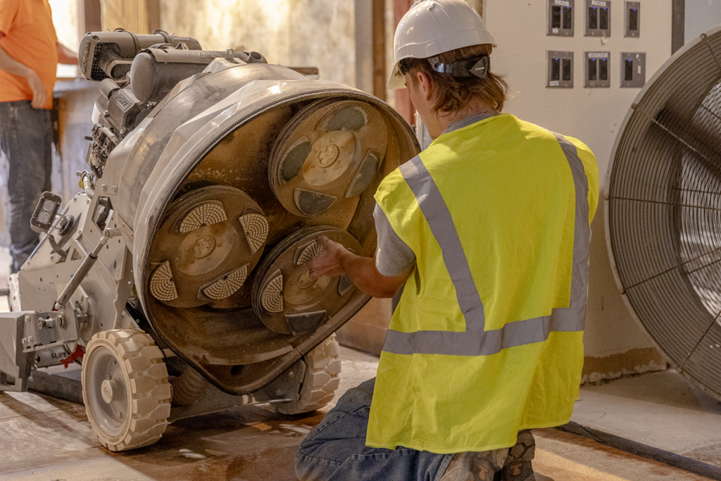 Horsley Concrete Division Member Swapping Concrete Polishing Heads on Machine